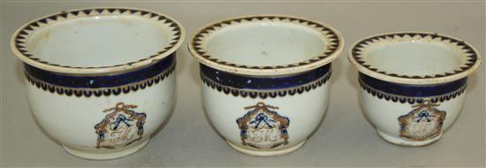 An unusual set of three graduated Chinese export enamelled porcelain flower pots, early 19th century, largest 11.5cm